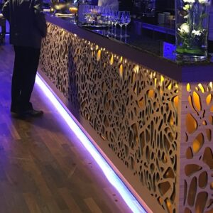 Elegant bar area featuring Magna Glaskeramik Champagne Brown surface with ambient lighting, London United Kingdom