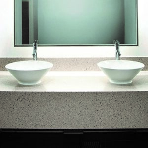 Elegant bathroom with Samsung Radianz Antigua Beach quartz countertop and twin sinks.