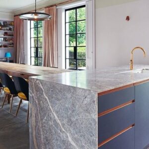 Modern kitchen island with Fiori Di Pesco marble in a London home.