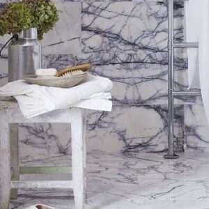 Bathroom featuring Milas Lilac Marble tiles, showcasing elegance and style in a London home.
