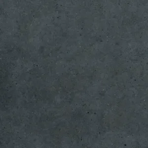 Close-up of Caesarstone Magnate worktop texture with clay grains and dark-grey flecks.