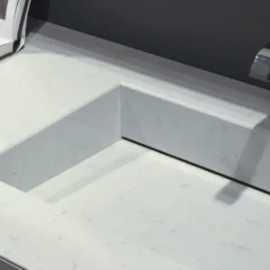 Sleek bathroom sink with Quartzforms Veined Michelangelo Quartz in elegant design.