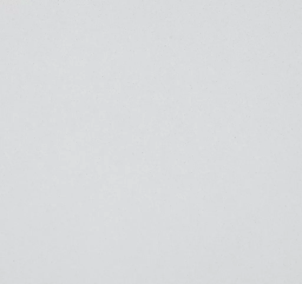 Close-up of CRL Polar White Quartz surface showing its smooth, glacier white texture.