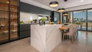 Modern kitchen featuring Technistone Calacatta Silva Quartz island in a London home.