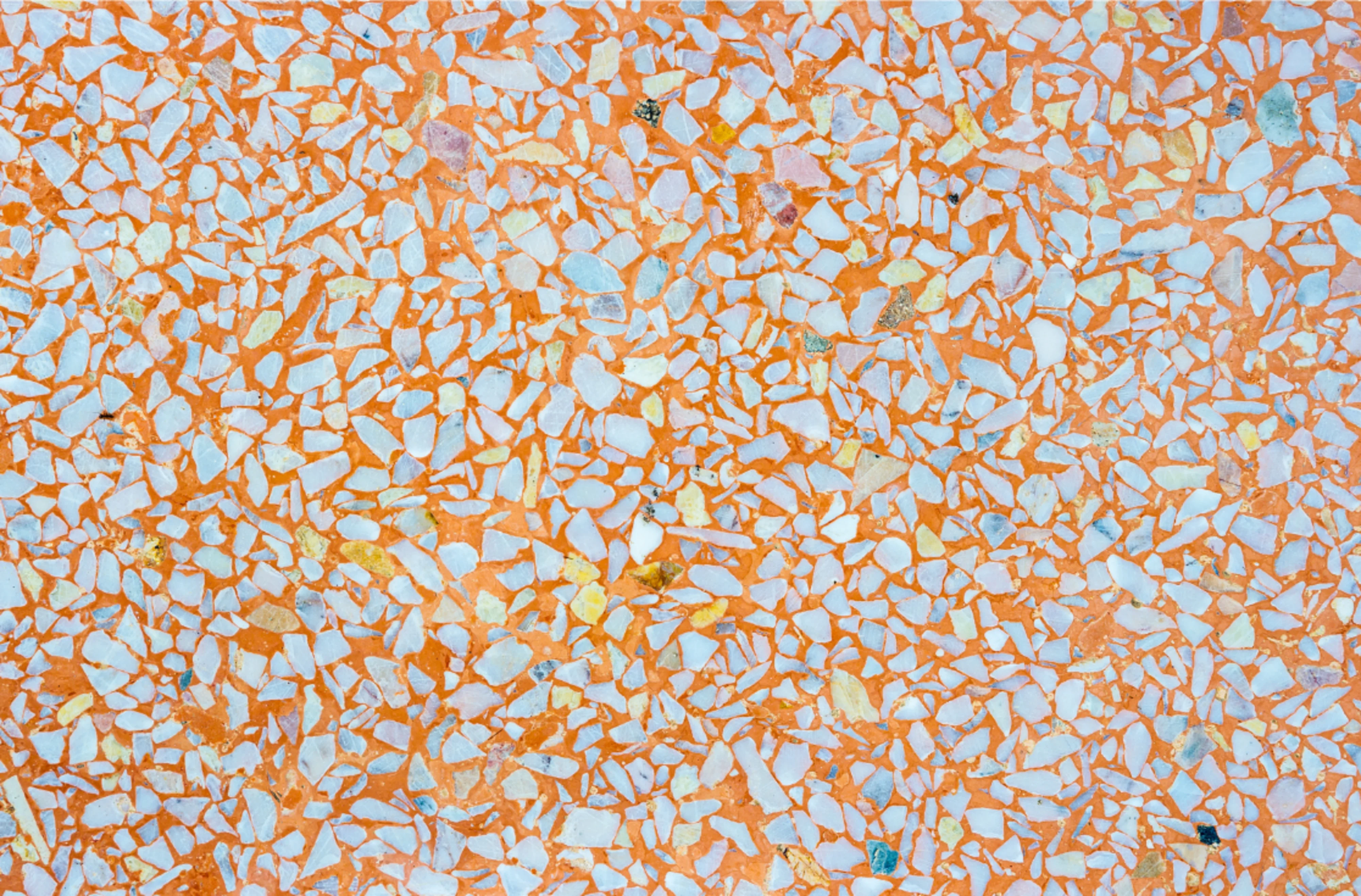 An orange and blue terrazzo surface.