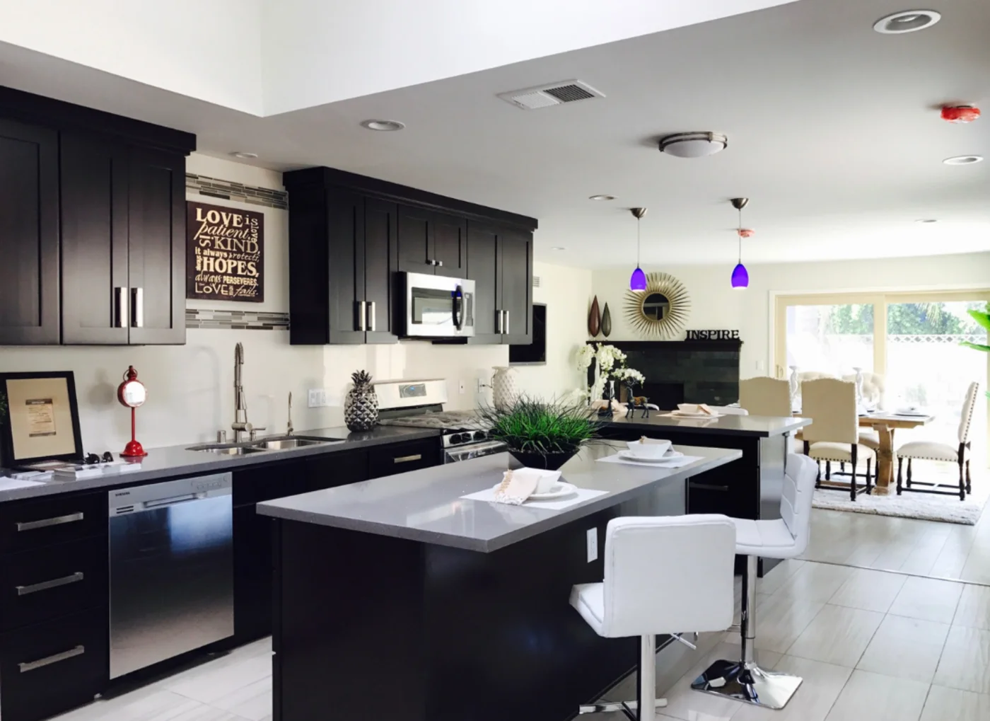 How to add value to your home. An open-concept kitchen with dark furniture.
