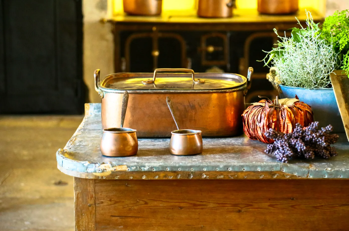 How to add value to your home. An old style cooking pot with some plants on the side.
