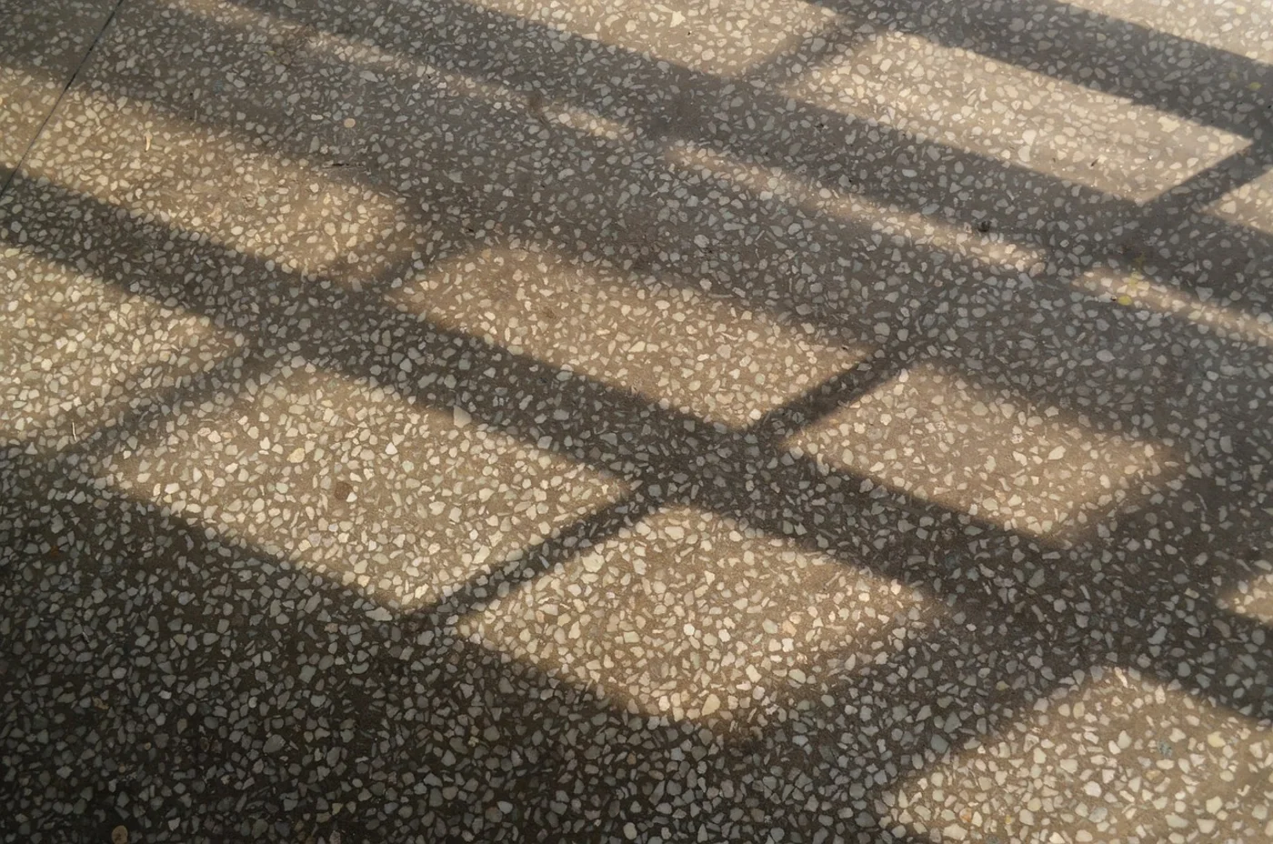 How to deep clean terrazzo floors quickly. A grey terrazzo floor.